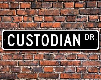 Custodian Drive sign on a brick wall 